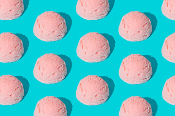 Pink strawberry ice cream pattern on light blue background. Summer food concept. Minimal isometric layout. Ice cream scoop aesthetic idea.