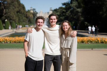 Obraz premium heartwarming scene of friends laughing together in sunny park sharing joyful moments surrounded by vibrant flowers