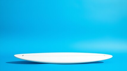 Fototapeta premium A pristine white surfboard rests on a vibrant blue background showcasing its sleek design and perfect shape for summer surfing adventures.