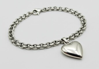 Silver bracelet with heart pendant isolated on white background