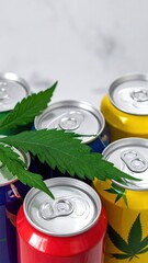 A vibrant green cannabis leaf rests atop a stack of colorful beverage cans, showcasing a blend of nature and modern consumer products in a striking composition.