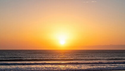 Obraz premium Sunset over ocean waves beachfront photography tranquil environment wide-angle view natural beauty