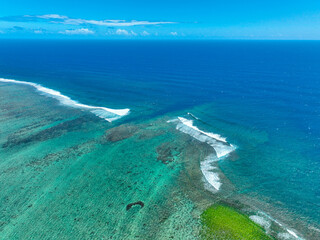 Aerial image of coastal cliffs and curving highway near Maconde Viewpoint, Mauritius