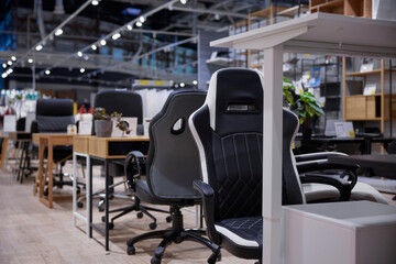 Modern office furniture showroom featuring ergonomic chairs and desks