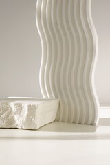 White stone pedestal, product presentation podium, template, white background, sunlight shadow. Abstract minimalist concept, empty podium display product, showcase for cosmetic products . Copy space