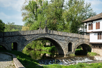 Fototapeta premium Old stone bridge over the river in the old town of Tryavna, Bulgaria