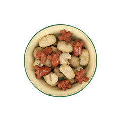 Flat lay of assorted Thai-style fried meatballs and sliced sausages served in a vintage enamel bowl. Popular street food snack in Thailand.
