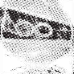 A close-up portrait reveals a focused face with prominent eyes.