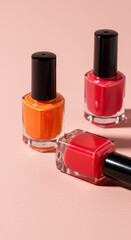Obraz premium Nail Polish Trio: Orange, Red, & Coral Hues for Perfect Manicures | Elegant Glass Bottles & Glossy Finish for a Modern Beauty Look