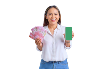 Cheerful young Asian woman showing blank screen mobile phone and holding money banknotes isolated on transparent background
