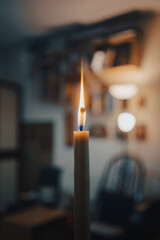 A lit candle in the household