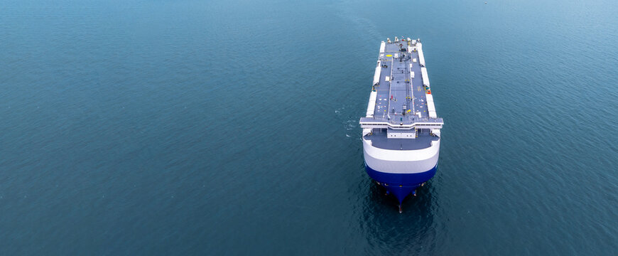 Aerial view RoRo Ship business logistic and transportation sea freight, Cargo and RoRo ship Roll On Roll Off ship at sea, Car carrier ship RO-RO Roll on Roll off.