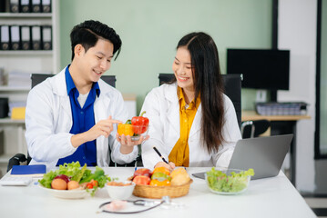 Doctors sharing fresh vegetables, promoting health and nutrition. Ideal for wellness, healthcare,...
