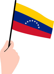 Woman's hand holding the Venezuela flag