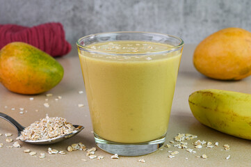 Banana mango oatmeal in a cup.