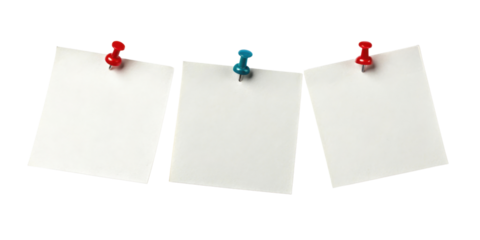 Three blank sticky notes pinned with colorful pushpins create vibrant display for reminders and ideas