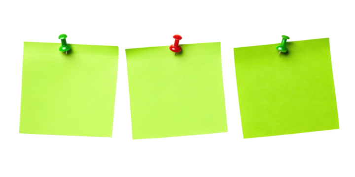 Bright green sticky notes pinned to board create organized and vibrant workspace, perfect for reminders and ideas