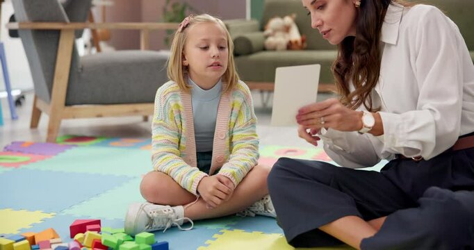 Speech therapy, psychologist and woman in office, girl and adhd with conversation, cards and help with lisp. Mature person, expert and child with questions, counseling evaluation or language learning