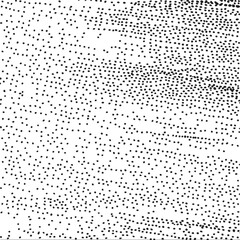 A dense arrangement of scattered black dots against a white background.