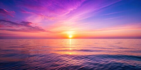 Obraz premium Sunset over a serene ocean with a gentle purple-pink gradient background, peaceful evening, calming atmosphere