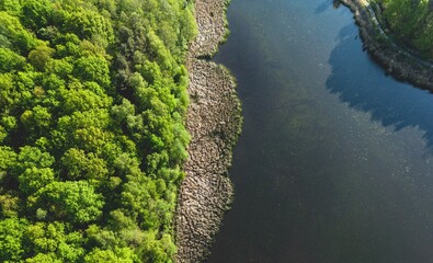 Beautiful green forest in the Polish countryside from a drone, lakes in Poland and a forest in the background, amazing drone shot of a forest, photos of a lake in Poland, amazing green island