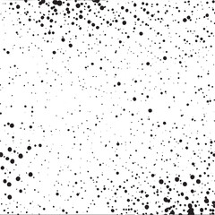 Obraz premium A dense scattering of small dark dots covers a bright white background.