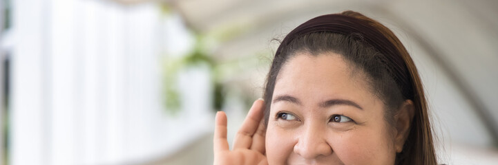 Happy Southeast Asian Indian woman hearing or listening with happy smiling positive mood, feeling...