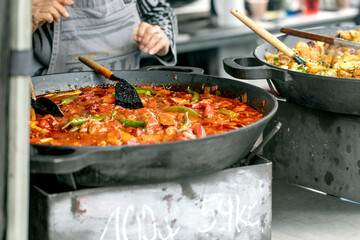 Chef Cooking Stew in Cast Iron