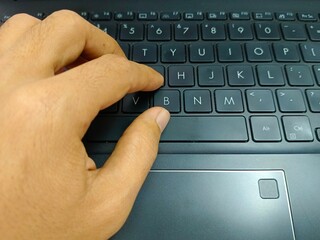 Typing on Laptop Keyboard with Finger Pressing Keys