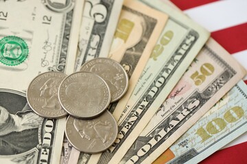 American US dollars money bills and on American flag close up