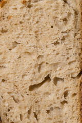 Macro Close-Up of Artisan Bread Crumb Structure in Harsh Lighting