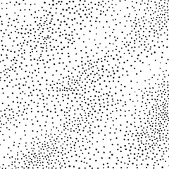 A dense field of scattered black dots against a white background.