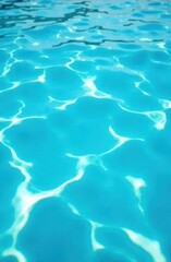 Obraz premium crystal clear turquoise water surface with abstract reflections creating wavy patterns. summer vacation concept. tranquility, relaxation. background, travel brochure, water themed design.