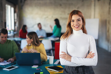 Portrait of young software developer in coworking open space