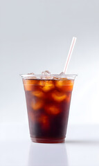Cola cold drink with ice cubes, in plastic cup, isolated on a white studio background
