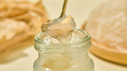 Close-up photo of bird's nest fibers distilled with sweet sugar and stored in a glass jar. The...
