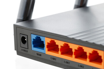Close-up of a wireless router with jacks for connecting an Ethernet cable. Network concept