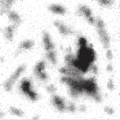 A grayscale displays a blurred textured of dark and light dots.