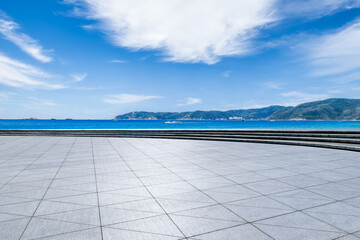 Empty square floor and blue sea with mountain natural landscape under blue sky