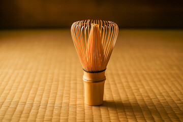 Bamboo matcha whisk standing on tatami
