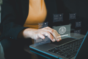 Employee confidentiality concept. Person use laptop with virtual padlock icon with confidential word to access documents data and cyber security for managing corporate files and employee information.