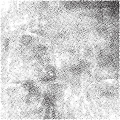 A textured monochrome surface displays a dense of small dots.