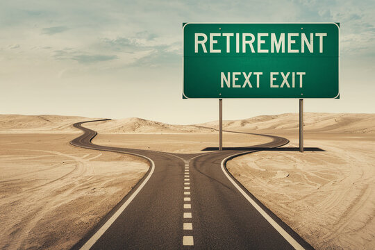 Forking road in desert landscape, green sign reads "Retirement Next Exit", symbolizing life choices and the transition to retirement