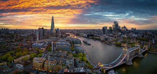 Panoramic aerial view of the London skyline with Tower Bridge, river Thames and the major tourist attractions during sunset time