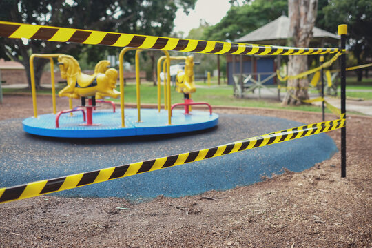 Safety black and yellow tape blocking off playground