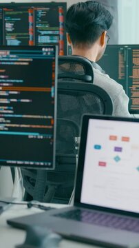 Vertical Screen : Group Adult Asia male, female freelance typing write prompt AI bot app smart program nomad, video game, terminal with coding language, designer, big data center on desktop computer.