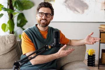 Content creator recording podcast from home using microphone