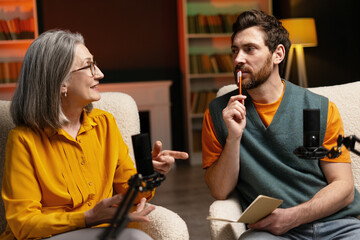 Podcasters recording a new episode in home studio