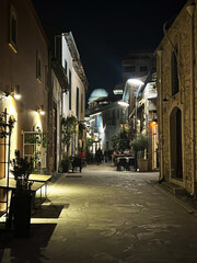 Enchanting nighttime street scene in cyprus bask in the warm glow of historic architecture