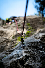  Close-Up Of A Quickdraw Attached To A Rock Wall With A Climbing Rope, Ready For Lead Climbing At Nago, Italy